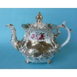 A teapot probably by Rockingham the cover having a crown knop, the foliate decorated body