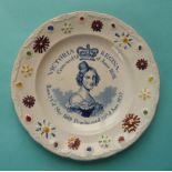 1838 Coronation: a Staffordshire pottery nursery plate printed in blue within a colourful border,