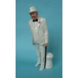 Winston Churchill: a Royal Doulton figure depicted standing dressed in a white suit, 262mm (