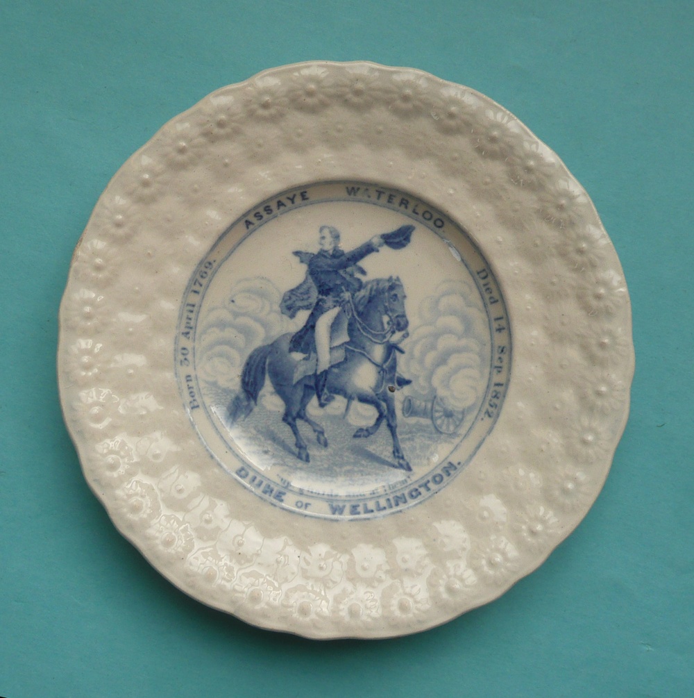 1852 Wellington in Memoriam: a nursery plate with floret moulded border printed in blue, 156mm (