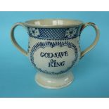 George III: a pearlware twin handled cup inscribed ‘God save the King’ in blue, circa 1789, 125mm,