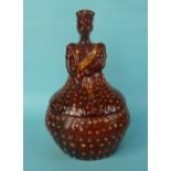 Victoria: a stylish stoneware bottle, depicted in formal dress, the brown glazed body with yellow