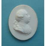 George III: a white ground glass relief probably by James Tassie depicted head and shoulders looking