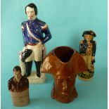 A brown glazed pottery maskhead pottery jug of Napoleon by George Skey, 230mm, handle repaired,