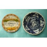 A colourful Delft dish decorated with scenes of war and peace inscribed for the Versailles Peace
