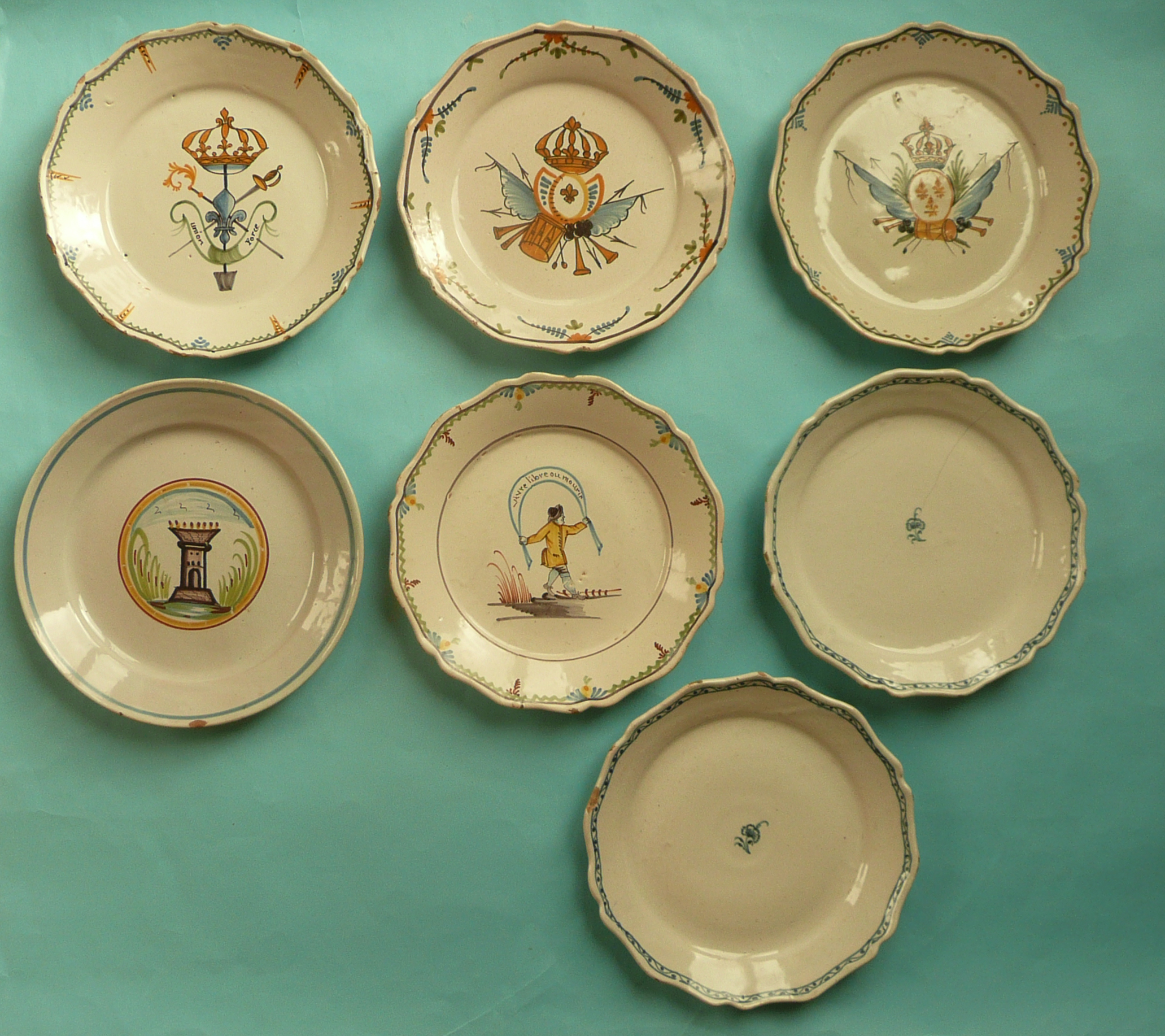 French Revolution: three faience plates each painted with trophies in support of the French