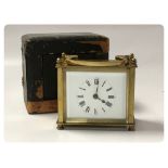 A SMALL BRASS FRENCH CARRIAGE CLOCK, PRESENTED IN ORIGINAL LEATHERED TRAVEL CASE,