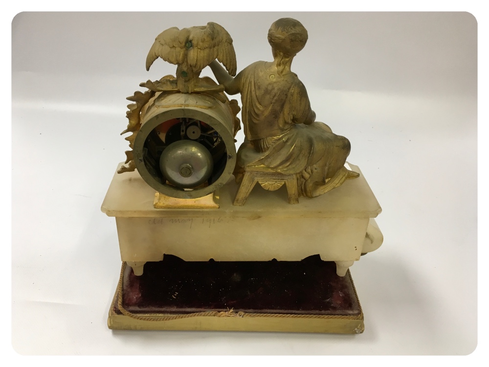 A FRENCH GILT METAL AND HARDSTONE MANTEL CLOCK IN THE FORM OF A SEATED CLASSICAL LADY WITH AN EAGLE - Image 2 of 2