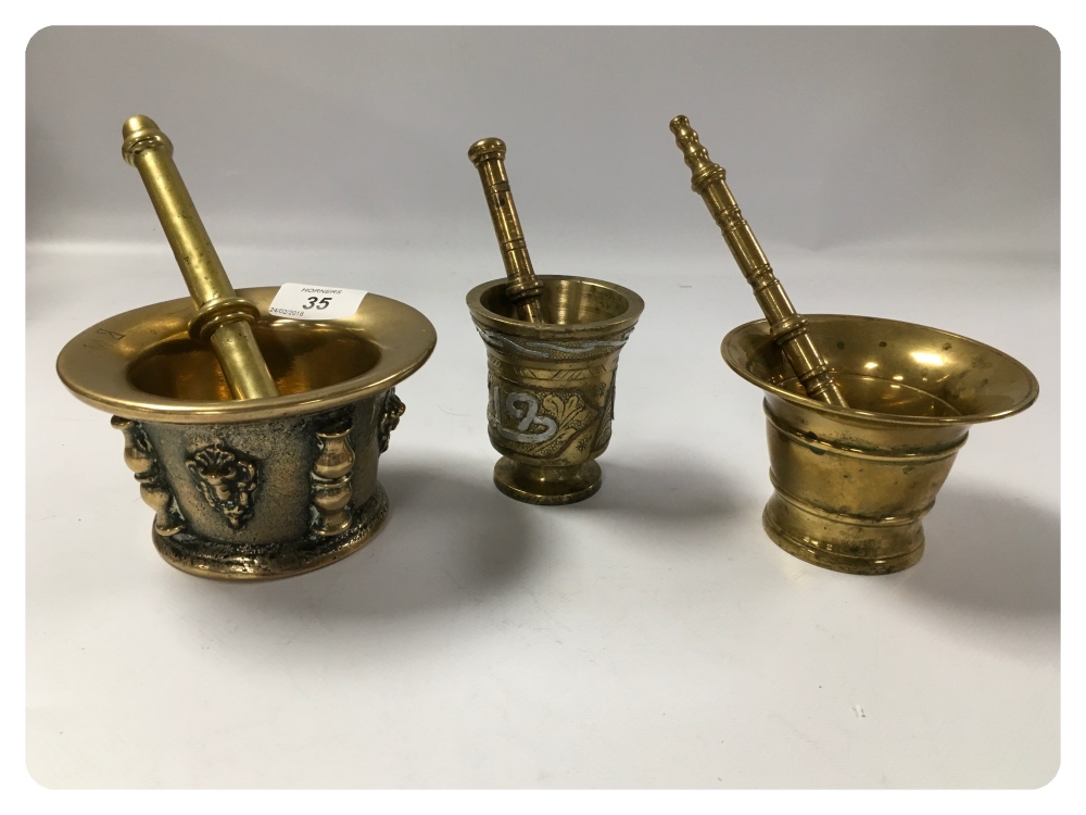 THREE ANTIQUE BRASS APOTHECARY MORTAR AND PESTLE ONE INITIALLED