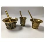 THREE ANTIQUE BRASS APOTHECARY MORTAR AND PESTLE ONE INITIALLED