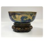 WEDGWOOD LUSTRE DRAGON DESIGN BOWL ON A CARVED HARDWOOD STAND 26CM. DIA.