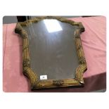 A C19TH FRENCH GILT FRAMED WALL MIRROR OF SHAPED REED AND SHELL DESIGN,