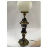 A FRENCH PORCELAIN AND GILT METAL TABLE LAMP