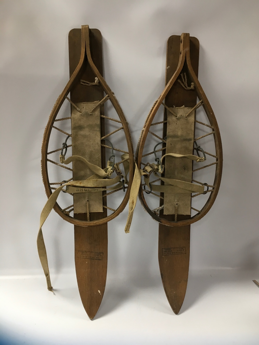 A PAIR OF VINTAGE WOODEN SNOW SHOES WITH COTTON BINDINGS, LENGTH OVERALL 75 CM, STAMPED L. - Image 2 of 3