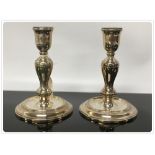 A PAIR OF SILVER CANDLESTICKS C20TH.