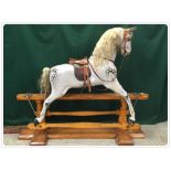 AN ORIGINAL VICTORIAN LARGE SCALE DAPPLE GREY ROCKING HORSE WITH ORIGINAL LEATHER SADDLE AND TACK,