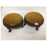 A PAIR OF VICTORIAN MAHOGANY CARVED CIRCULAR FOOT STOOLS