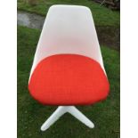 A MAURICE BURKE FOR ARKANA: A RETRO ARKANA STAR CHAIR WITH ORANGE SEAT CUSHION.