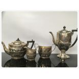 A FOUR PIECE SILVER TEASET, COMPRISING TEAPOT, COFFEE POT, SUGAR AND MILK, BEARING FAMILY CREST,