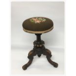 EDWARDIAN MAHOGANY RISE AND FALL MUSIC STOOL WITH CIRCULAR TAPESTRY SEAT