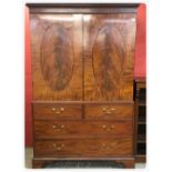 GEORGIAN MAHOGANY LINEN PRESS, THE DOORS WITH OVAL PANELS WITH CROSS BAND AND STRINGING INLAY,