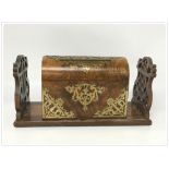 A DOMED WALNUT DESK LETTER BOX WITH APPLIED BRASS DETAIL,