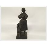 A 19TH CENTURY BRONZE FIGURE OF A WOMAN IN ARMOUR,