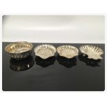 A PAIR OF SILVER SCALLOP DISHES AND ONE OTHER ALONG WITH A SMALL SILVER BOWL