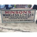 A 1950'S DOUBLE SIDED PAINTED WOODEN SIGN FOR "MINSONS" WIRELESS AND CYCLE SHOP