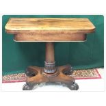 19TH CENTURY ROSEWOOD FOLDING TOP GAMES TABLE ON A SINGLE COLUMN PEDESTAL WITH PLATFORM BASE WITH