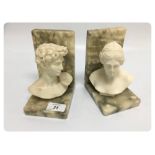 A PAIR OF CARVED ALABASTER BOOK ENDS, A