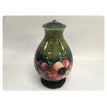 A MOORCROFT POPPY DESIGN TABLE LAMP ON A