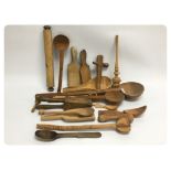 A COLLECTION OF TREEN KITCHEN UTENSILS,