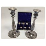 A PAIR OF MODERN WHITE METAL CANDLESTICK