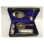 FIVE PIECE CASED SILVER BACK BRUSH AND M