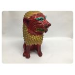 A BRIGHTLY PAINTED TERRACOTTA "FOO LION"