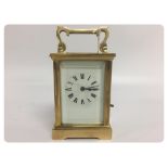 CARRIAGE CLOCK, GLASS AND BRASS CASE