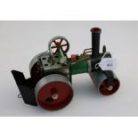 A Mamod live steam, steam roller,with green coachwork, complete with steering rod and burner, 25cm