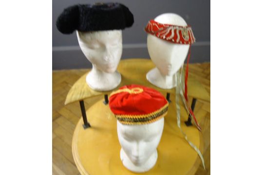 A mixed lot, a Greek headdress, a Turkish cap with tassel, and a Spanish bullfighter's hat