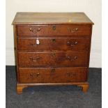 A George III oak chest, the rectangular top with moulded edge over four graduated long drawers
