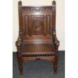 A 19th century Arts and Crafts oak throne chair, having navette capitals over a demi-lunette