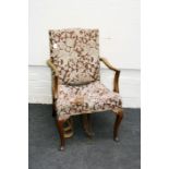 A 19th century Gainsborough style mahogany open library armchair, with cabriole supports