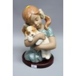 A Lladro porcelain half length bust of Gabriella and puppy, number 2355, 35cm
