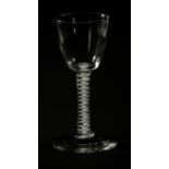 An 18th century inverted bell bowled ale glass, with double helical cotton twist stem over a