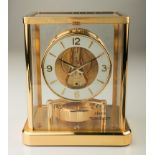 Jaeger Le Coultre, a gilt metal Atmos clock, the dial with Arabic and baton numerals, in a five