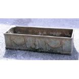 A 19th century cast iron plant trough, embossed with swags, 60cm wide