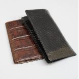A black pipe wallet, together with a brown crocodile wallet and other items