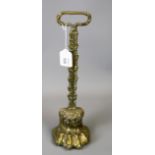 A 19th century cast brass and iron loaded lion's paw door porter, 39cm high