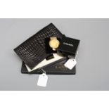 A Lanvin black crocodile card wallet in box, and a Chanel note holder in a gold coloured box