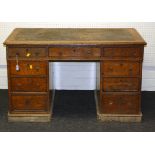 A late Victorian oak twin pedestal writing desk with leather inset top, 123cm